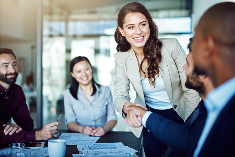 women with straight teeth in business meeting