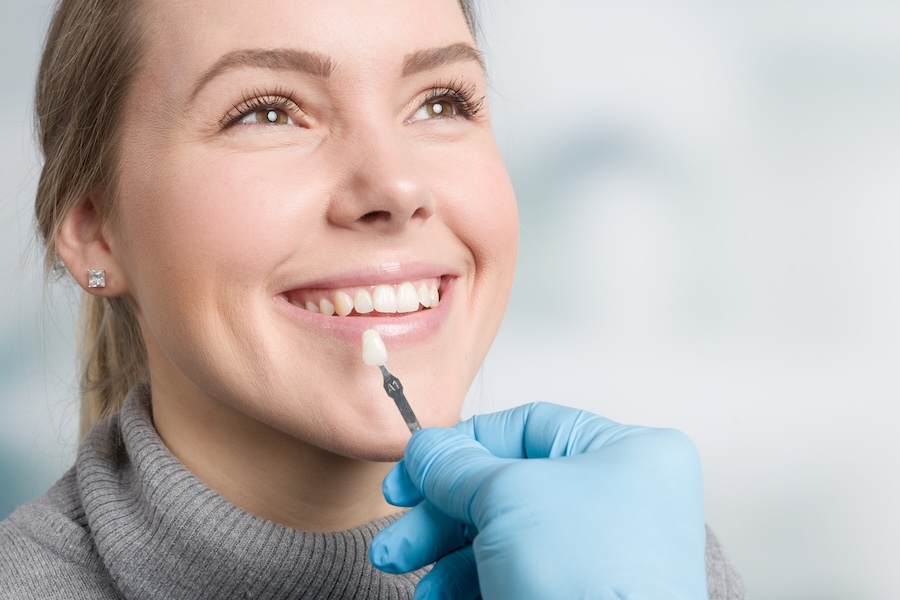 woman trying to get natural looking veneers instead of veneers that look fake or unnatural