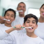 family brushing their teeth, not overbrushing, aggressive brushing