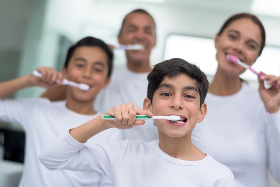 family brushing their teeth, not overbrushing, aggressive brushing