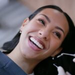 woman in dental chair for a cleaning with the dental hygienist