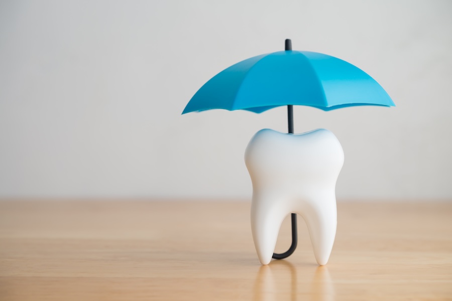 image of umbrella over a tooth for a dental membership plan