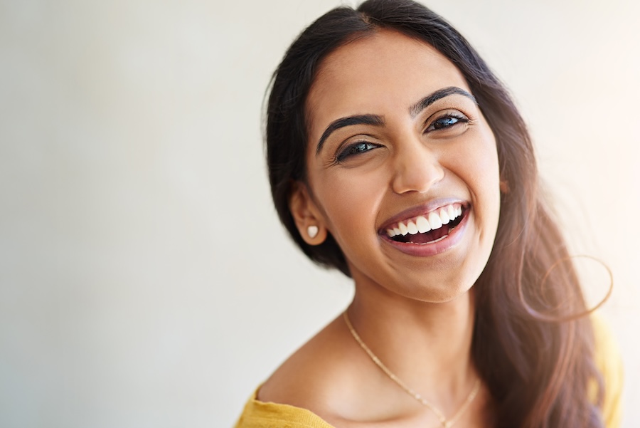 woman smiling after cosmetic dentistry