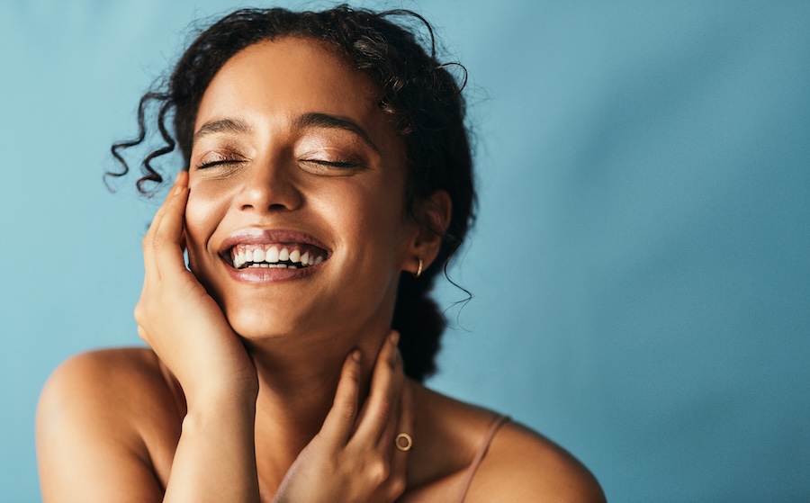 smiling woman with dental bonding on front teeth