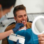 man in dental chair to see what can dental veneers fix
