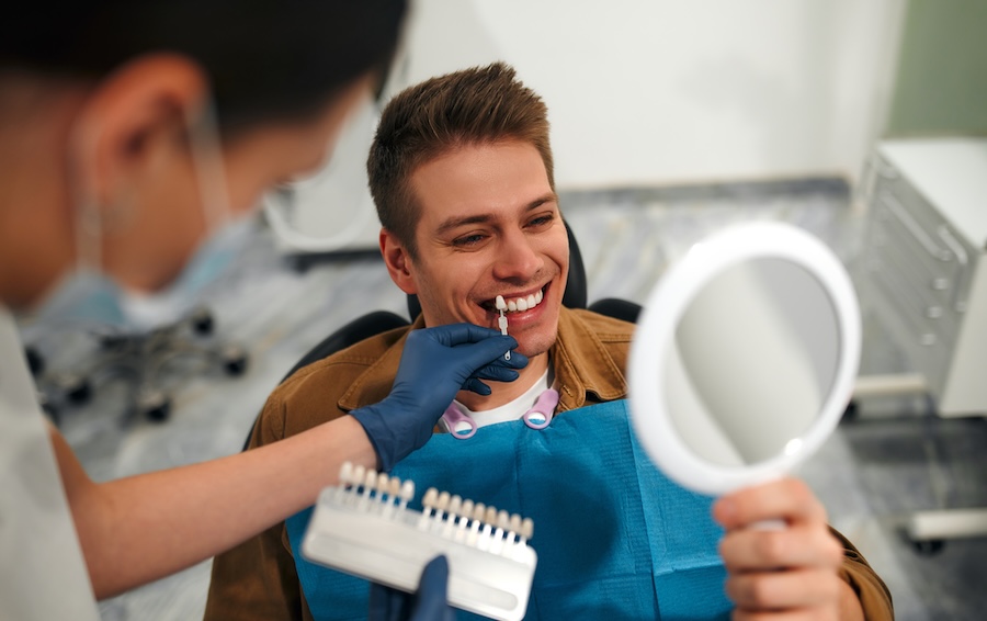 man in dental chair to see what can dental veneers fix