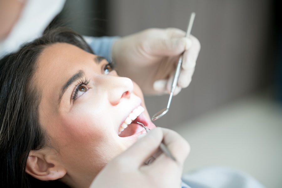 woman at dentist for dental cleaning